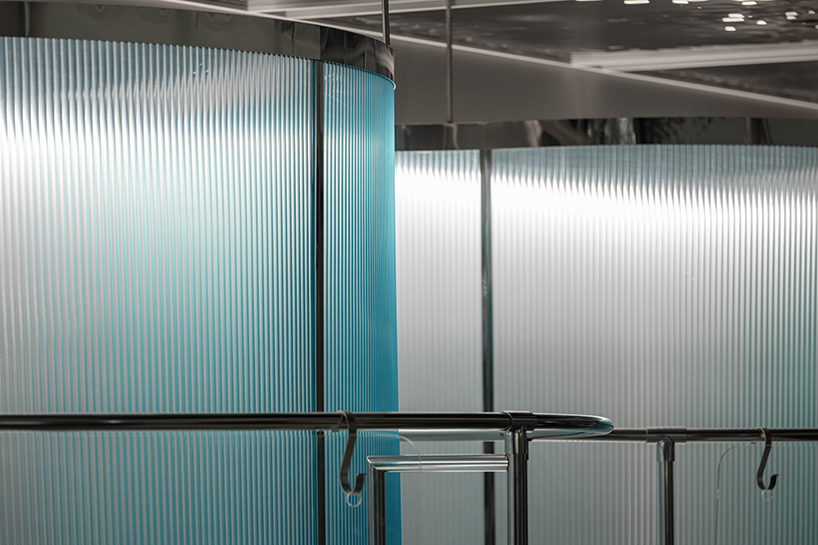 steel interiors ripple like waves in niiiz design lab's korean swimwear store