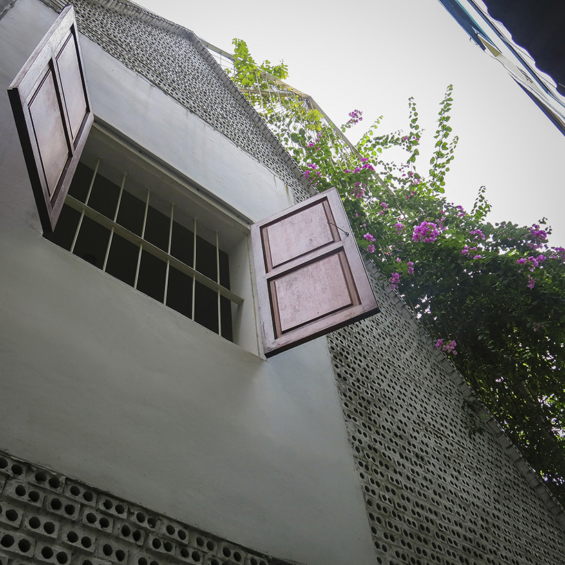 hole-brick wall maximizes airflow and daylight for tiny house in vietnam