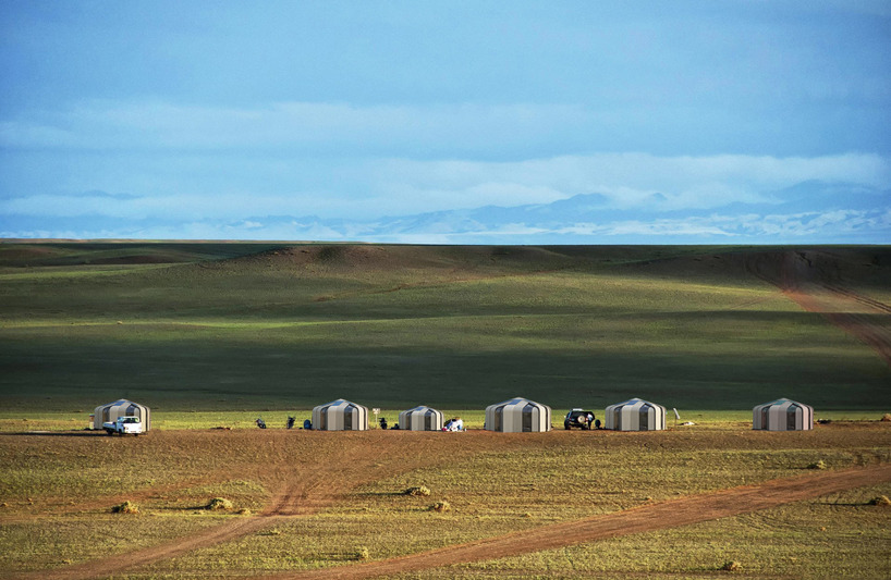 curved plywood panel segments shape a transformable modern kazakh yurt