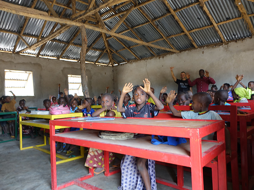 balouo salo and local artisans handcraft wooden furniture for underprivileged schools in rural senegal