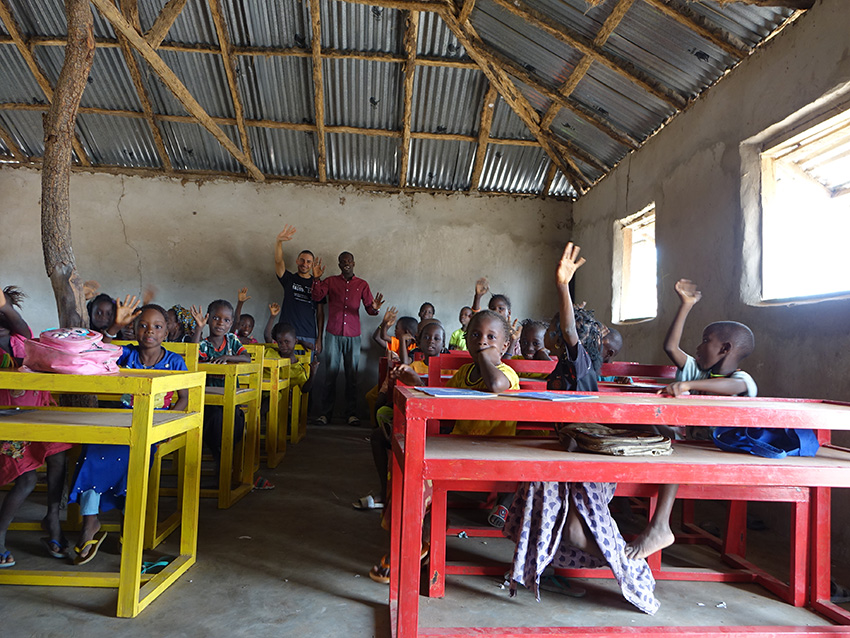 balouo salo and local artisans handcraft wooden furniture for underprivileged schools in rural senegal