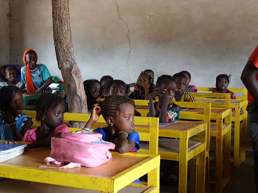 balouo salo and local artisans handcraft wooden furniture for underprivileged schools in rural senegal