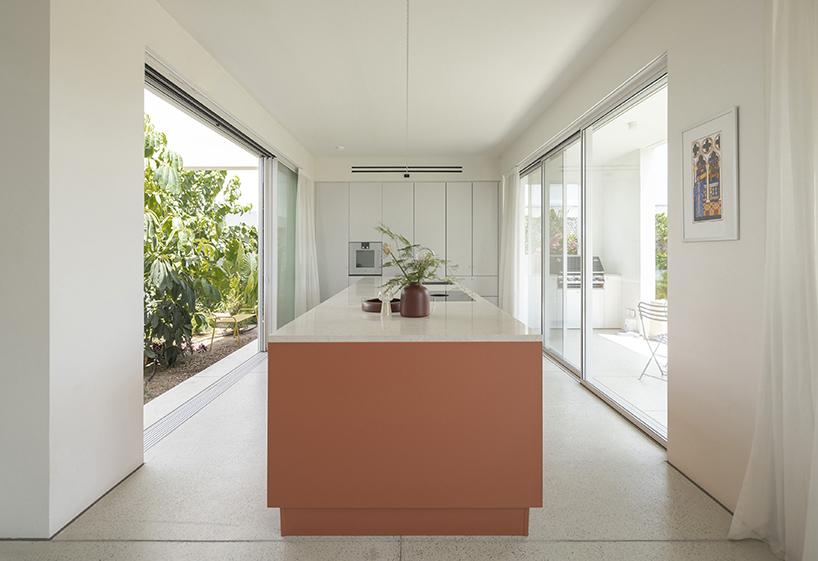 concentric white walls envelop garden-filled residence by draftworks* architects in cyprus