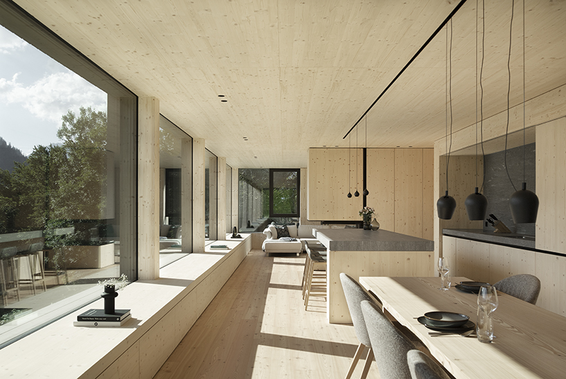 grey wooden framework shapes stable-like residence in swiss village