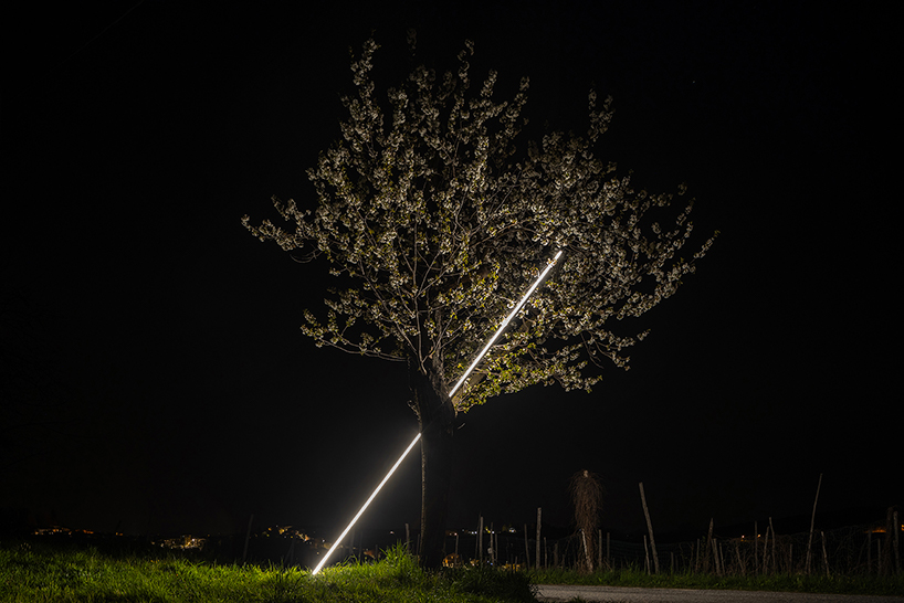 emilio ferro pierces chapel of san rocco with suspended beam of light in italy