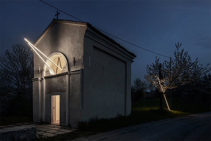 emilio ferro pierces chapel of san rocco with suspended beam of light in italy
