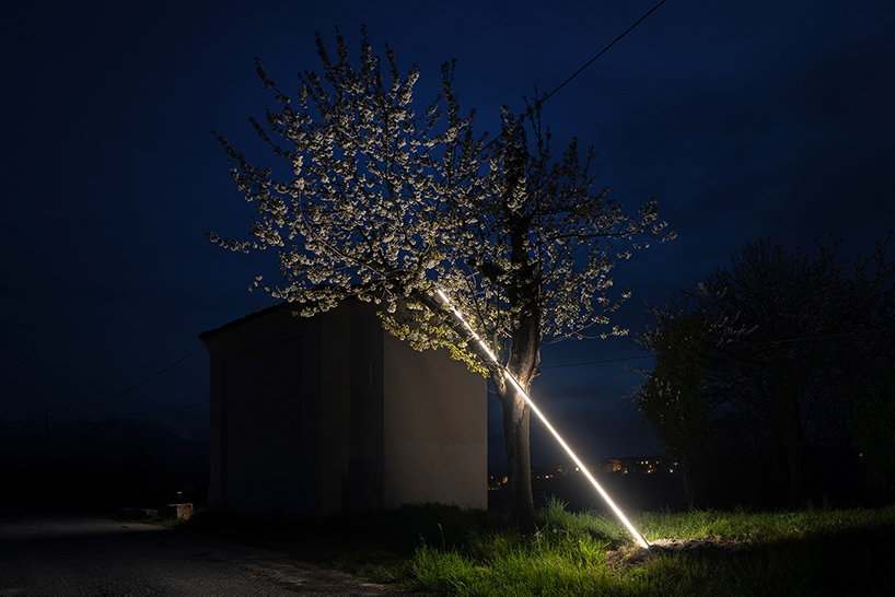 emilio ferro pierces chapel of san rocco with suspended beam of light in italy