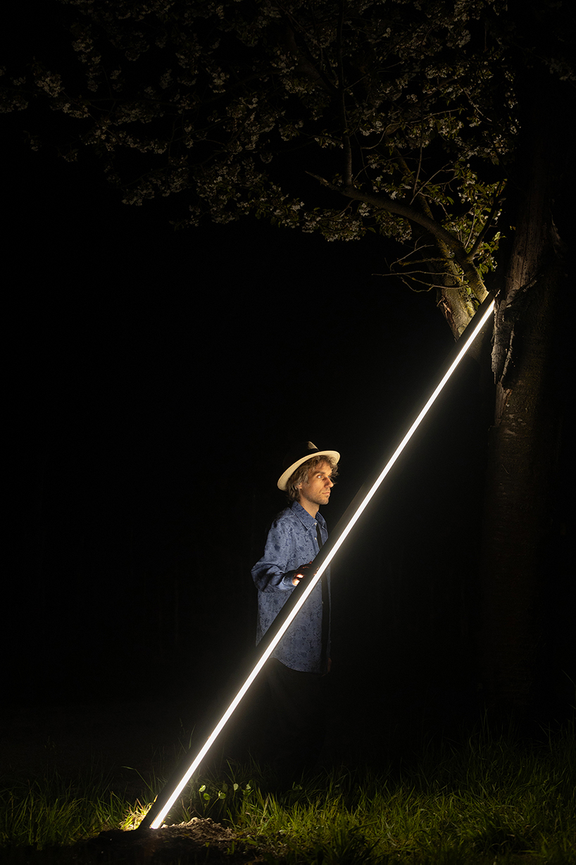 emilio ferro pierces chapel of san rocco with suspended beam of light in italy