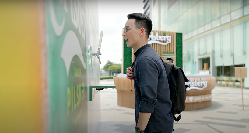 ai powered billboard dispenses free beer in vietnam 2