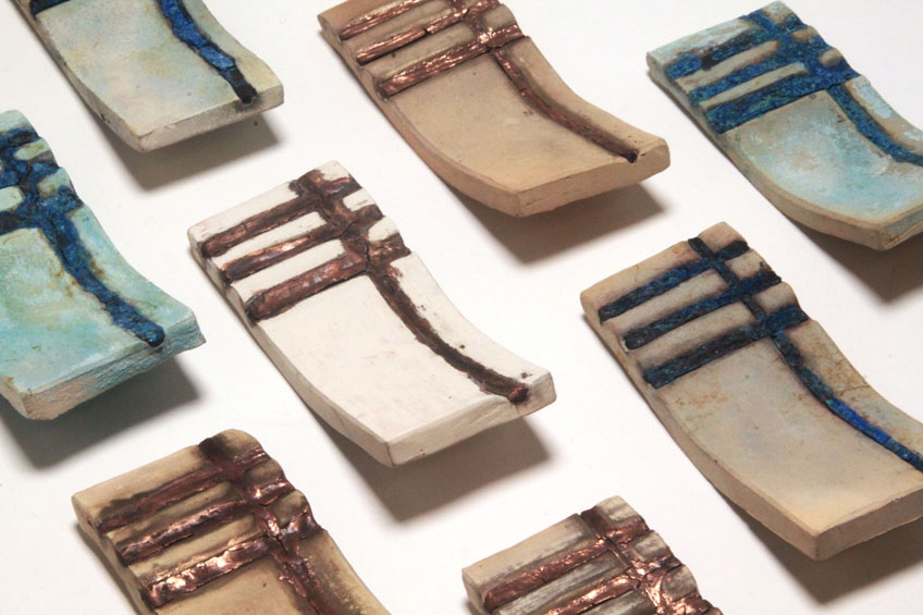 dyed ceramic tiles by yuval harel revalue the union of raw clay with metal through oxidization & corrosion