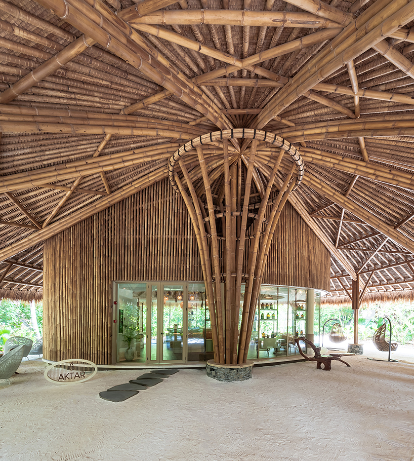 weaved bamboo roofs enclose pavilions for wellness resort in the maldives