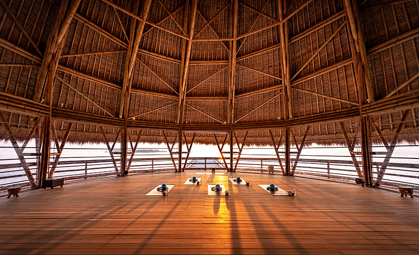 weaved bamboo roofs enclose pavilions for wellness resort in the maldives