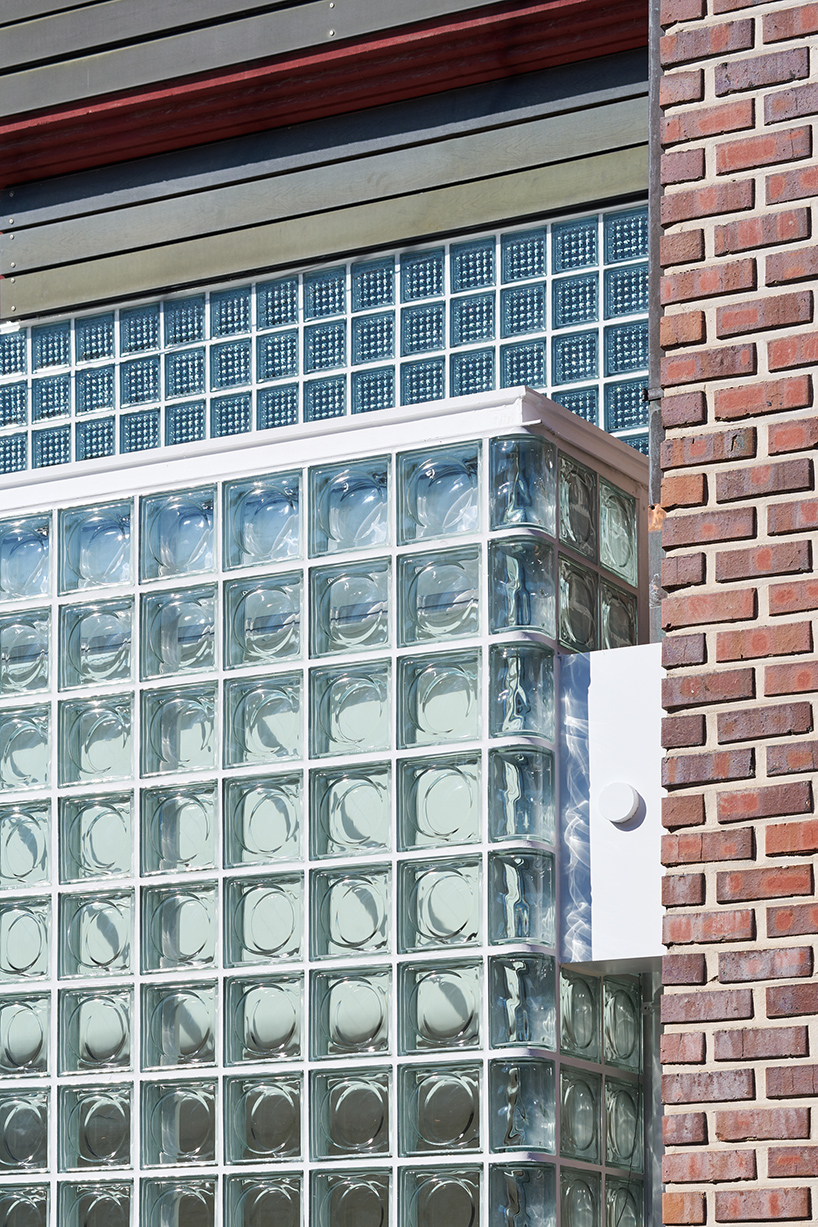 glass block surfaces by studio heech enclose brick structure in seoul