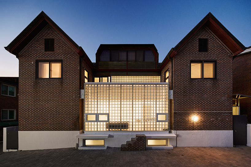 glass block surfaces by studio heech enclose brick structure in seoul