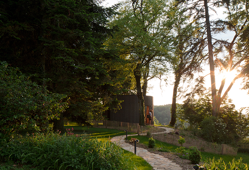 lumipod 6 takes shape as rounded wooden hotel cabin in the french countryside