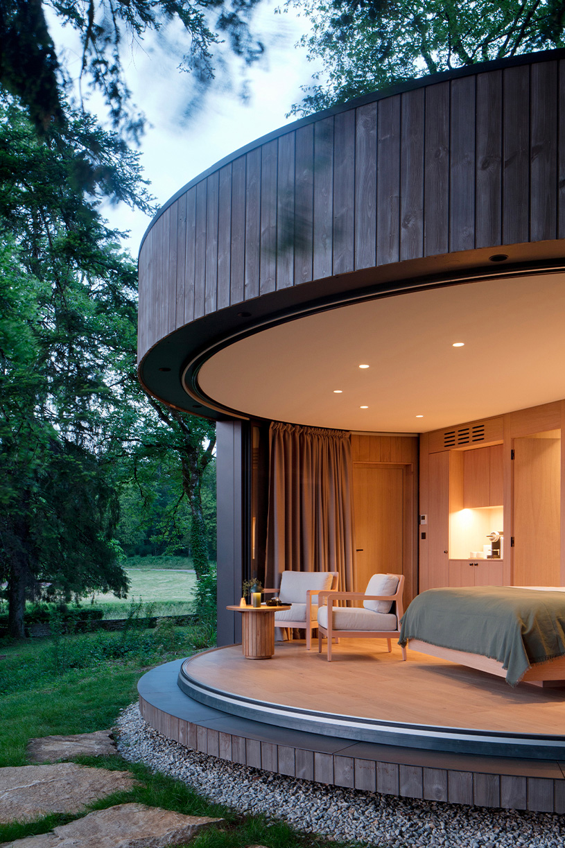 lumipod 6 takes shape as rounded wooden hotel cabin in the french countryside