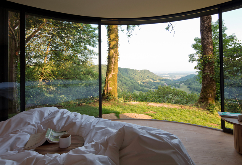 lumipod 6 takes shape as rounded wooden hotel cabin in french countryside