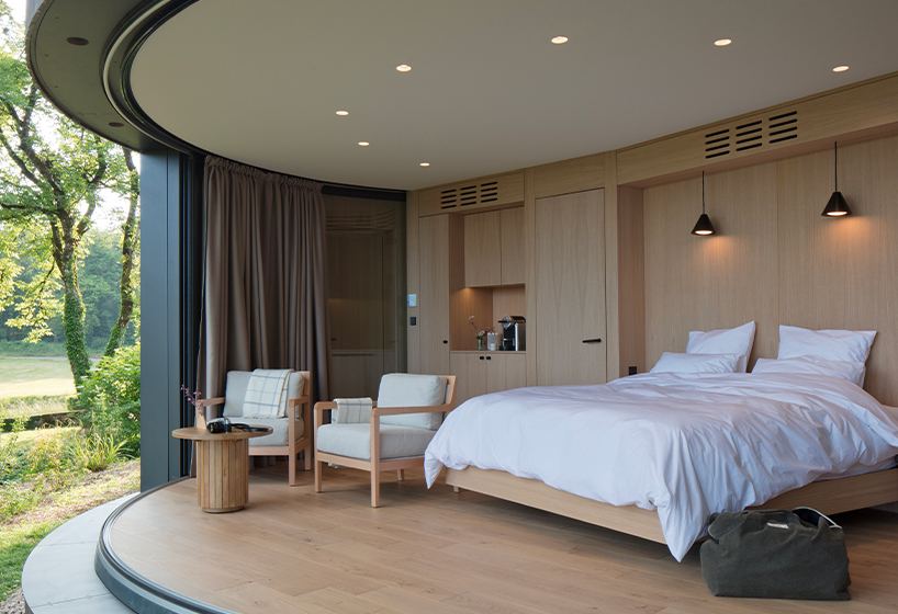 lumipod 6 takes shape as rounded wooden hotel cabin in french countryside
