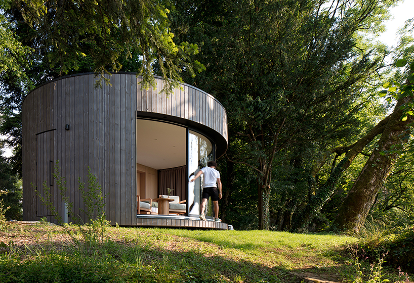 lumipod 6 takes shape as rounded wooden hotel cabin in french countryside