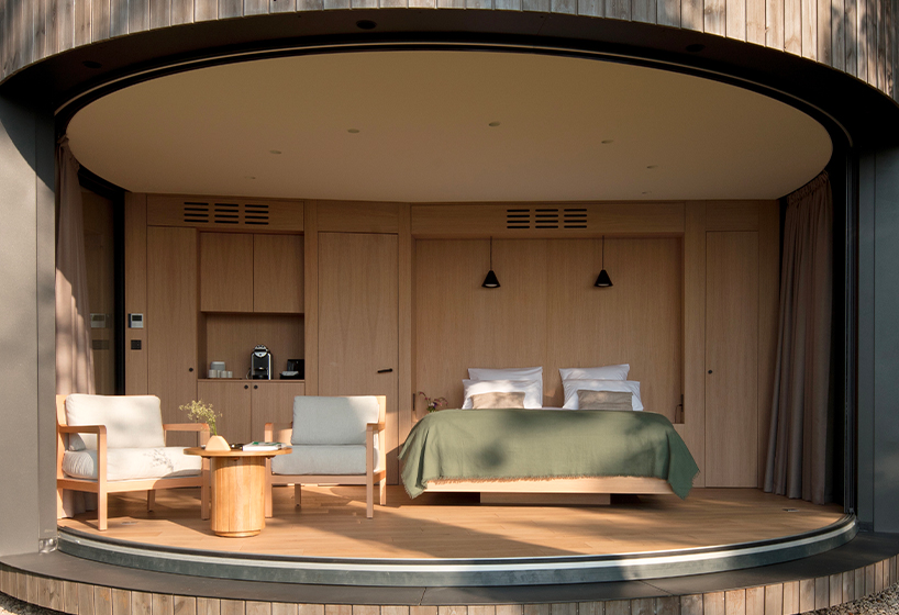 lumipod 6 takes shape as rounded wooden hotel cabin in the french countryside