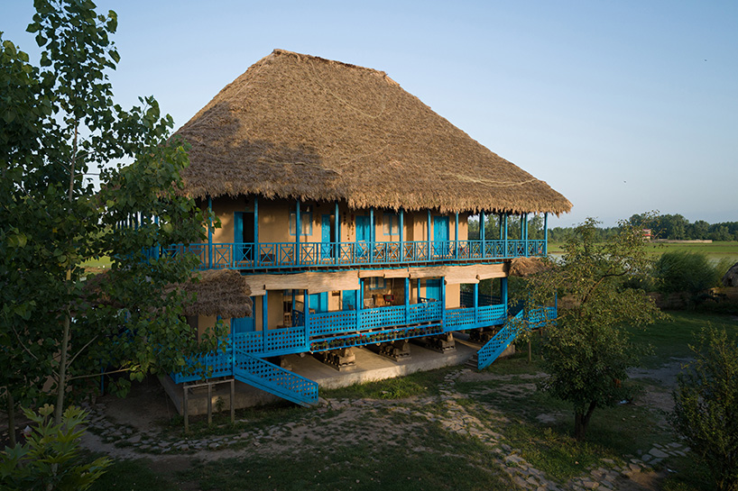 eco-lodge resort in iran stands on repurposed layered beams