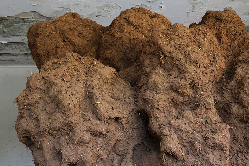bomb cloud sculpture takes shape in soil, straw and water inside abandoned lisbon school - 3