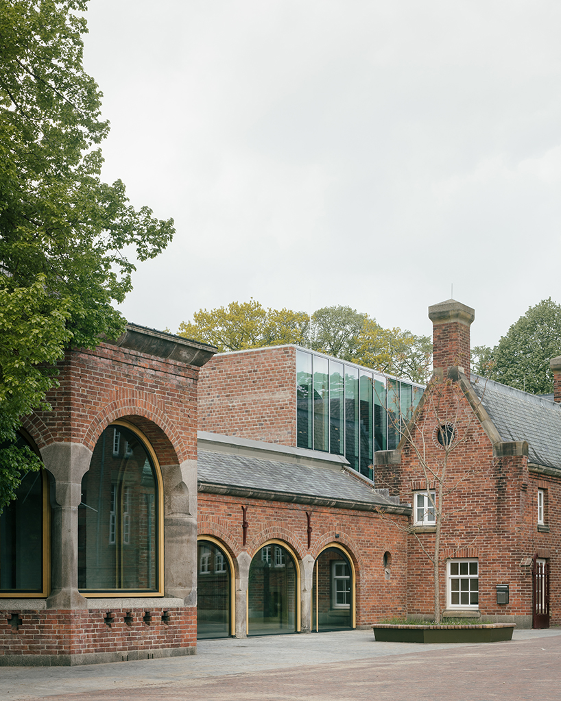 arched brickwork cut-outs by civic architects reveal renovated shoe museum