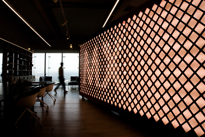 manufactura repurposes beeswax for sustainable translucent lattice panels at mexico city office