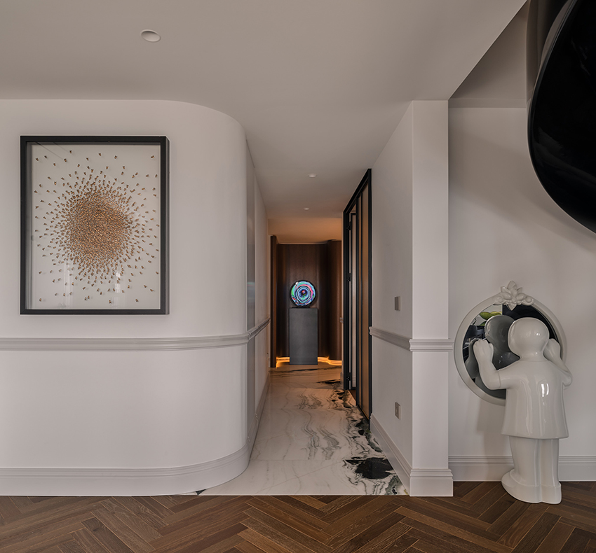 reflective sculptural staircase interposes in renovated roof apartment in istanbul