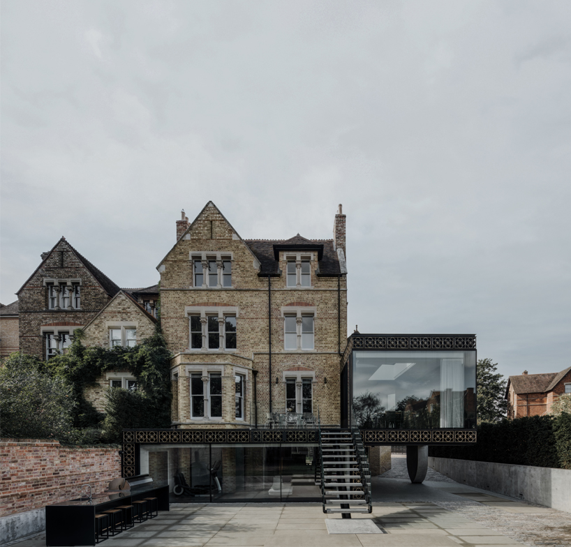 lightweight glass box adheres to 1870s gothic building after hyde + hyde's restoration