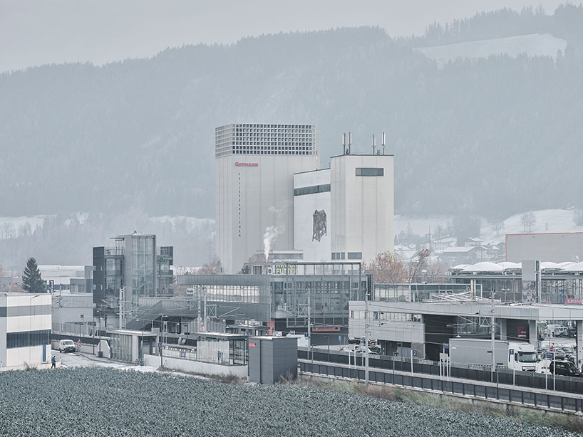 concrete crown by obsermoser + partner architekten transforms a 1978 grain silo into a storing-center for wood pellets