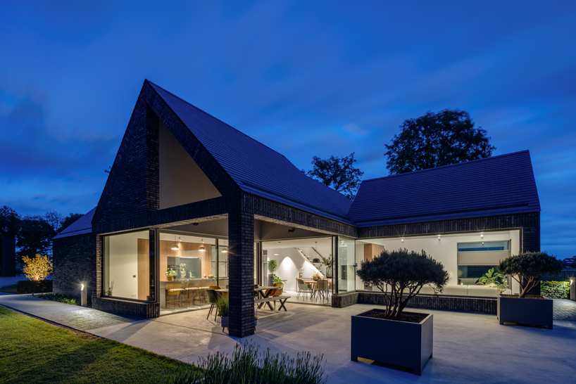 four-gabled-volumes-outline-cross-plan-residence-in-the-netherlands