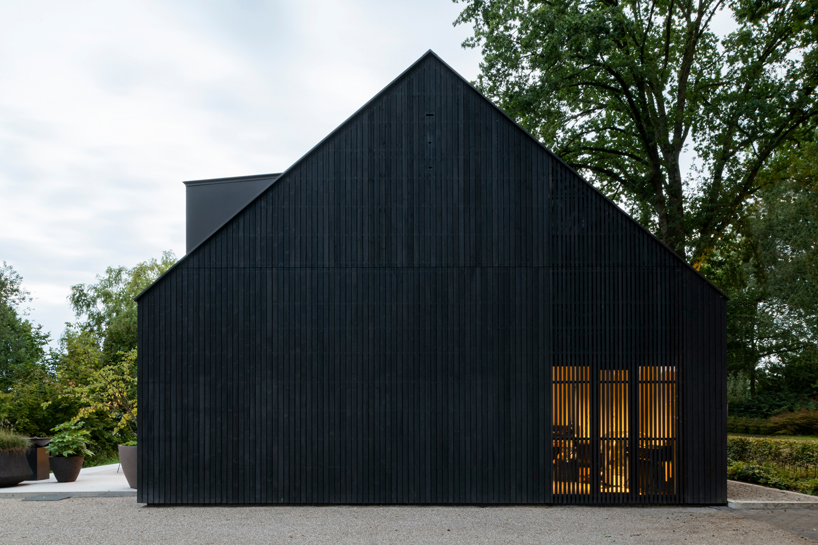 studio] [space nestles black barn-shaped office into the dutch landscape