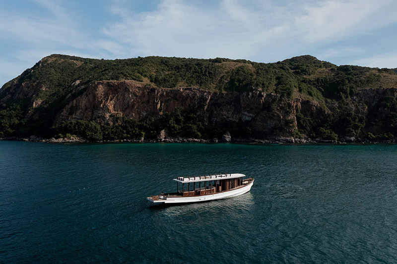 studio meanbeam restores former thai fishing boat 'sealyn' as wooden wellness cruiser