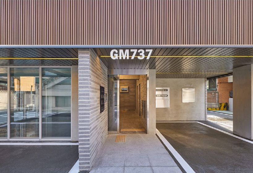 brick tiled residential building stands out in an alley of seoul