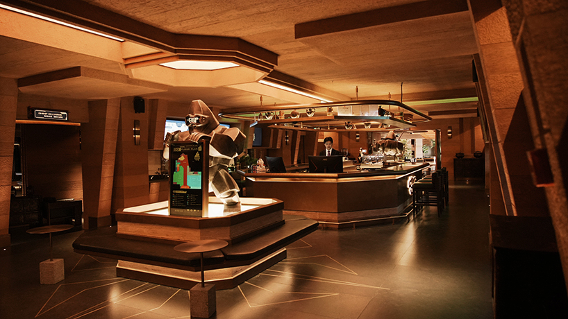 tibetan-style columns and antique furniture enliven wooton designers' chimp club café and bar