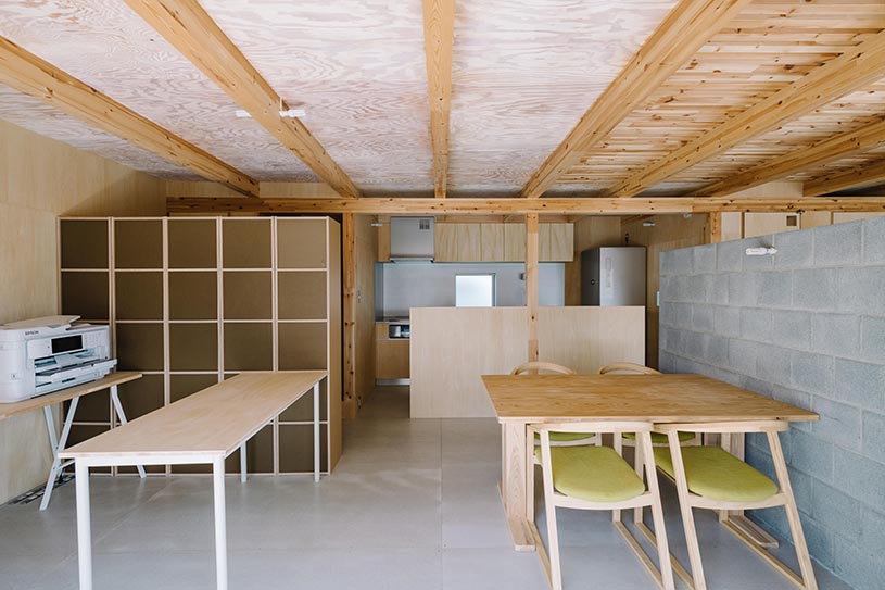 arched pergola loops over residential construction in japan covered in sheet metal