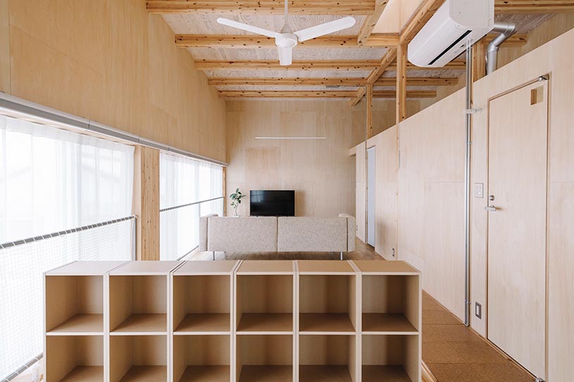 arched pergola loops over residential construction in japan covered in sheet metal