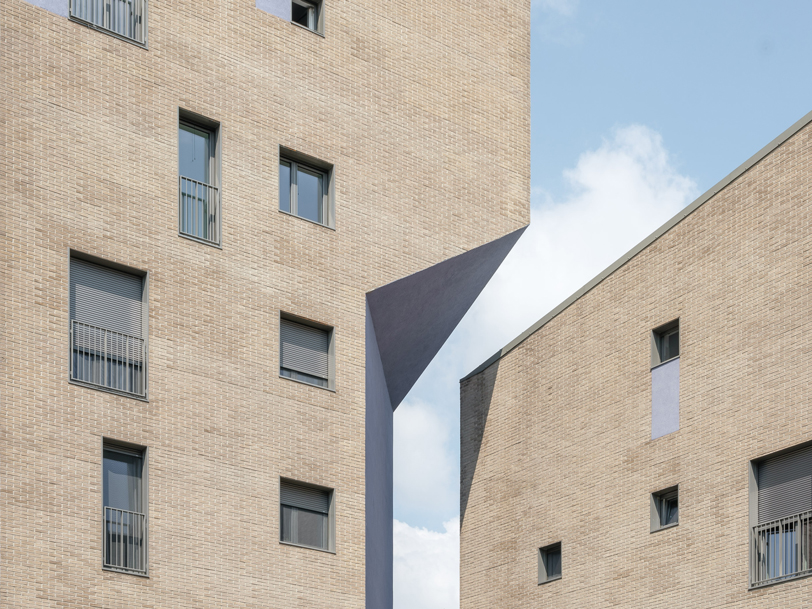 brick-clad residential complex by cino zucchi architetti expands along via valtorta in milan