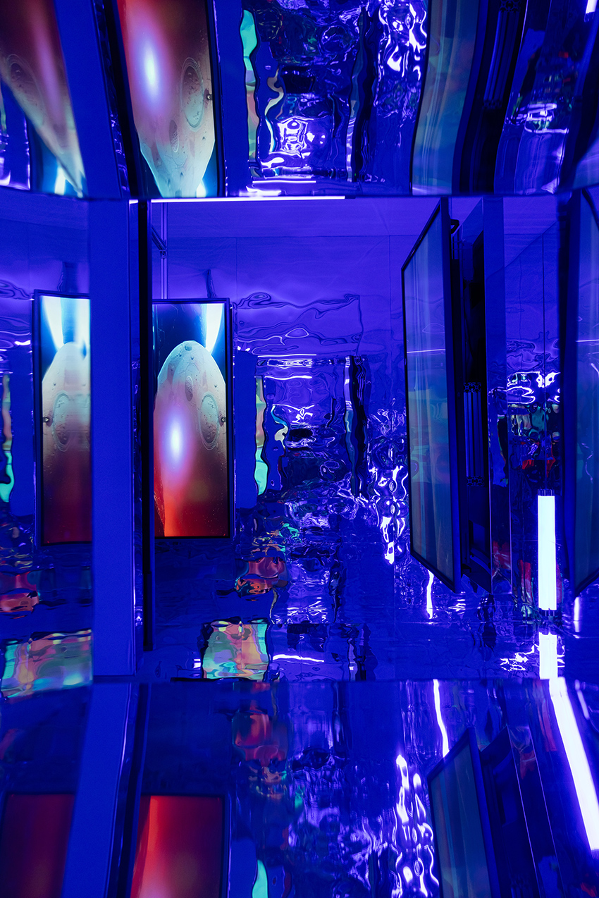 three suspended digital screens translate AI imagery into luminous spatial installation - 11