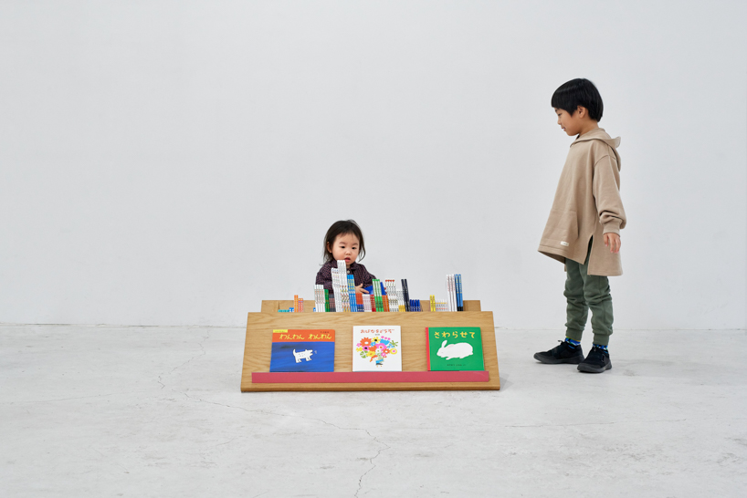 border design architects' mobile bookshelf with mountain-shaped fixtures invites children to independently explore