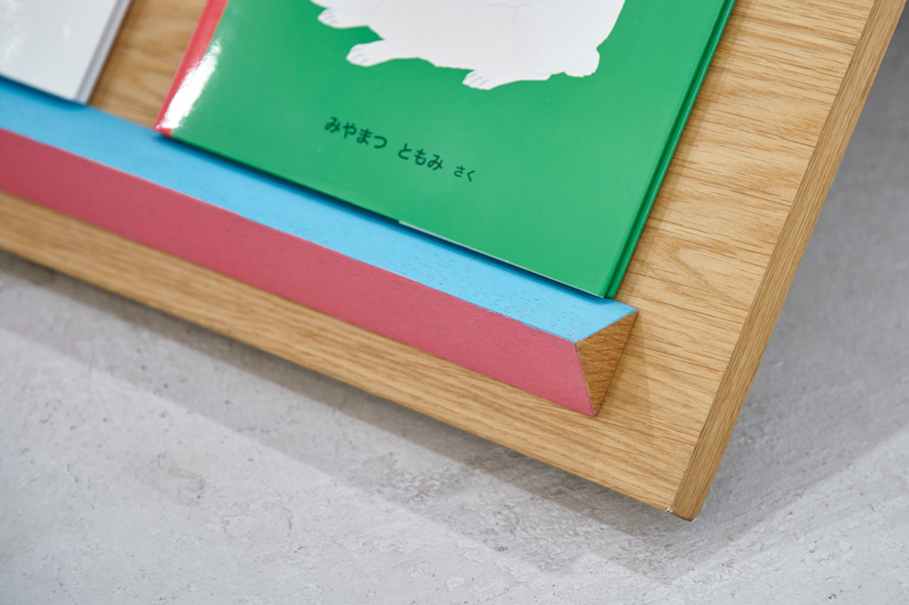 border design architects' mobile bookshelf with mountain-shaped fixtures invites children to independently explore