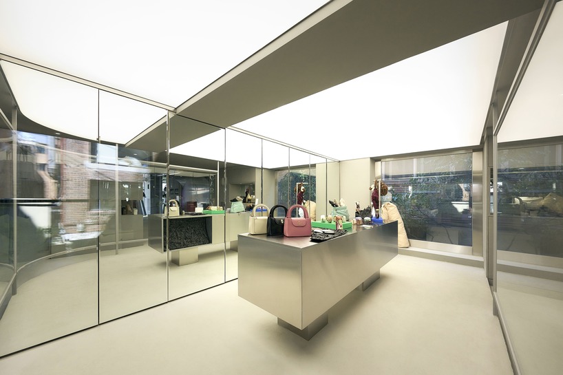 mirroring steel coats carlyn showroom's fluid curved interiors in seoul