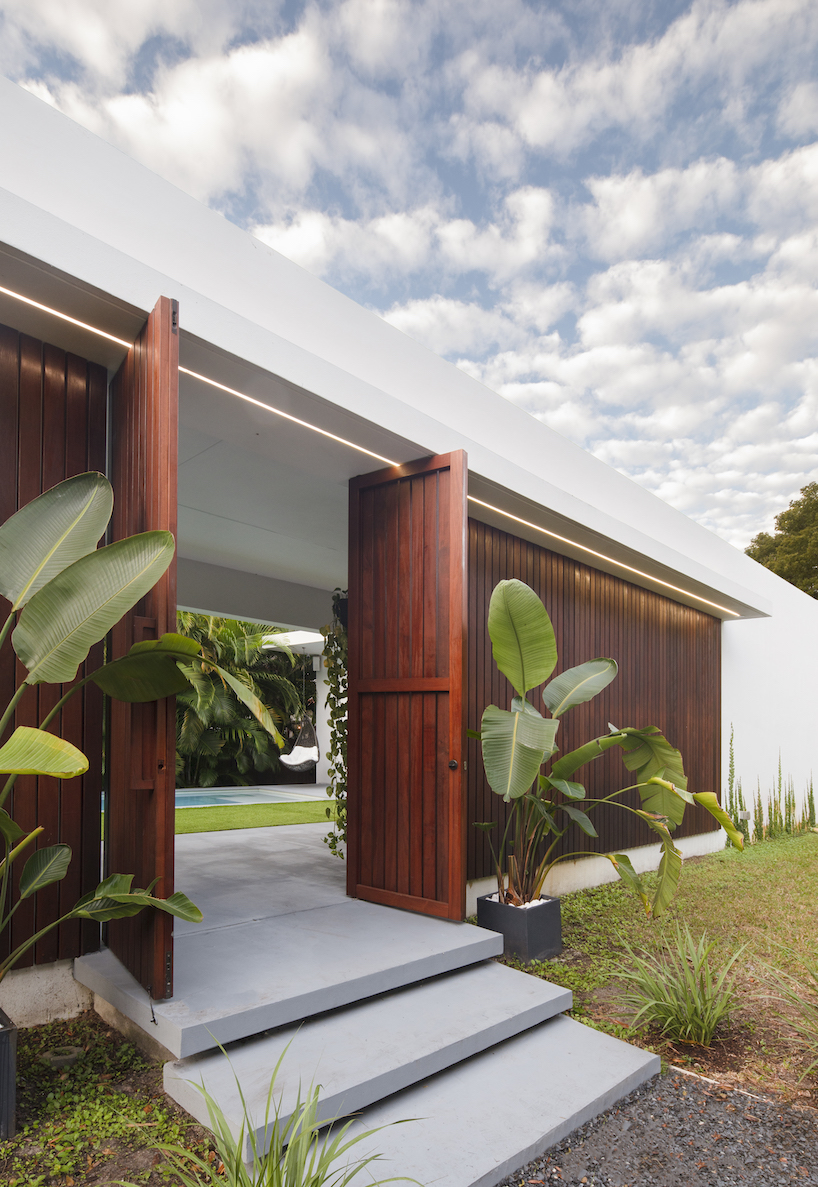 The minimalist oblong Pompei House sprawls across a narrow lot in Miami's historic enclave