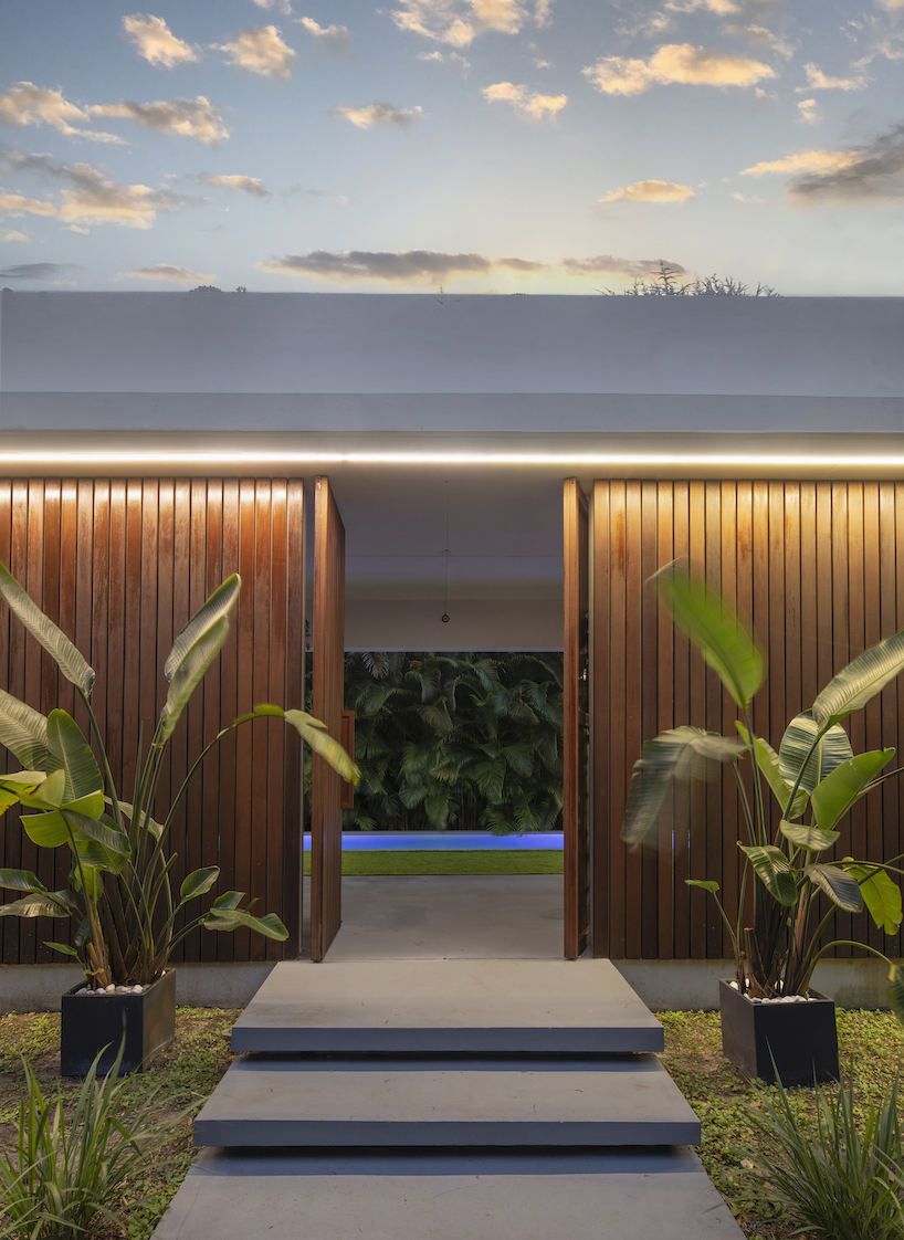 minimalist elongated casa pompei expands on narrow plot in historic miami enclave