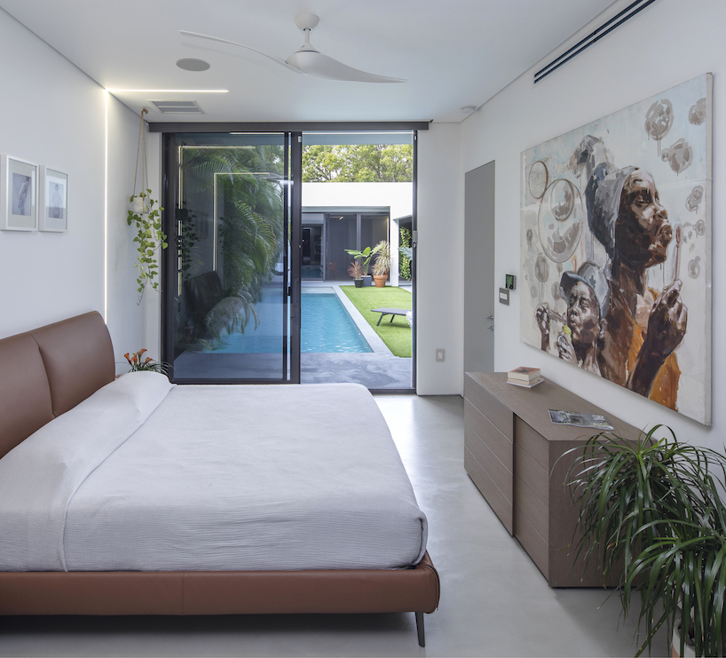 minimalist elongated casa pompei expands on narrow plot in historic miami enclave