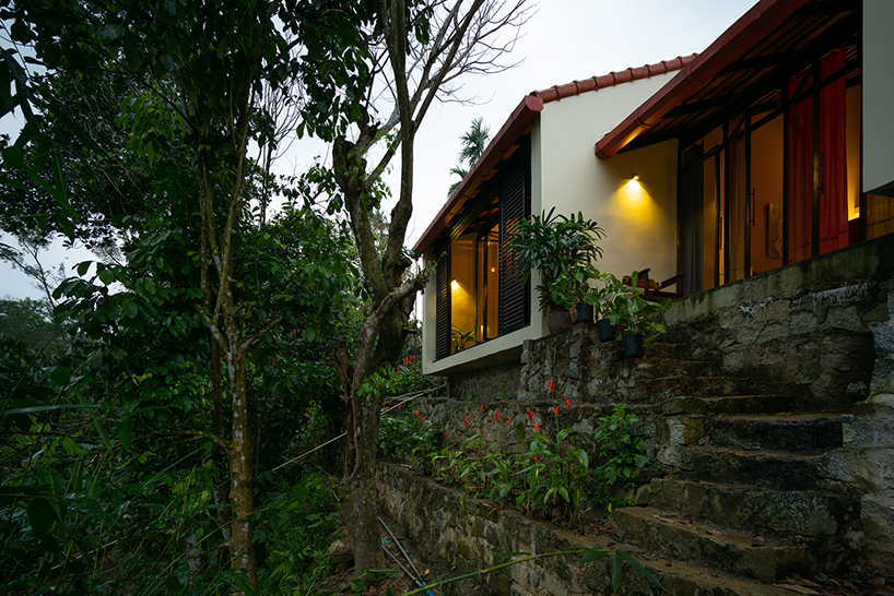 overlapping shingle roofs shield multileveled tien cam house in vietnam