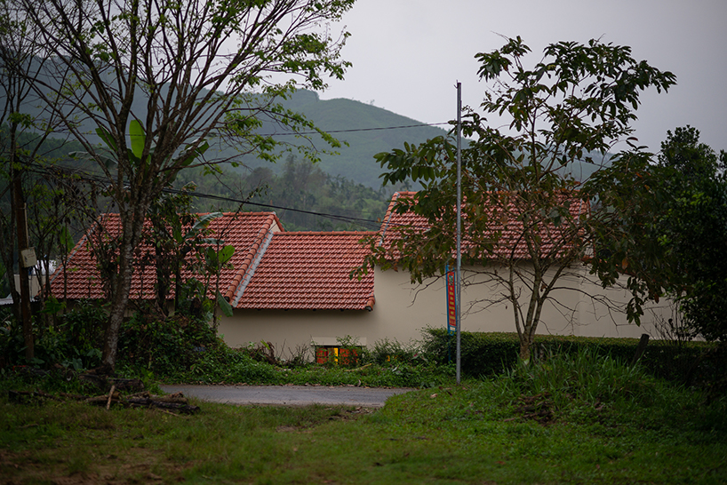 overlapping shingle roofs shield multileveled tien cam house in vietnam