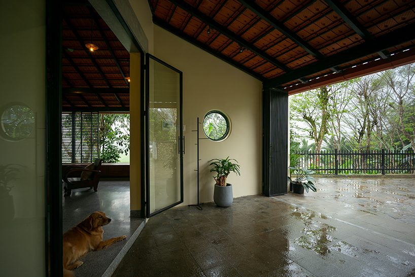 overlapping shingle roofs shield multileveled tien cam house in vietnam