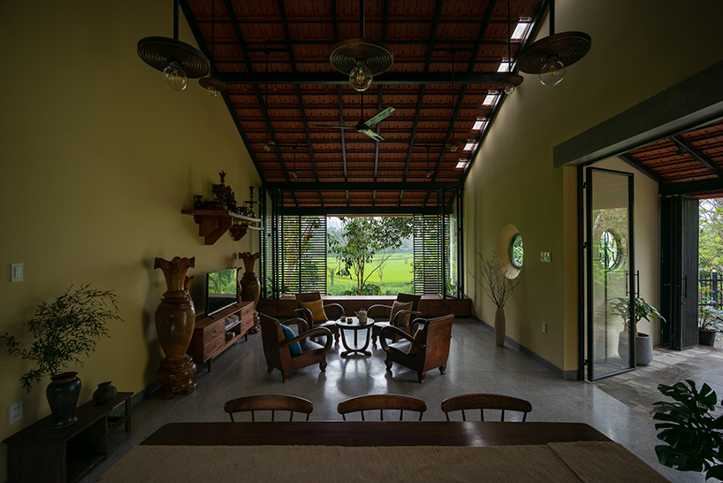 overlapping shingle roofs shield multileveled tien cam house in vietnam